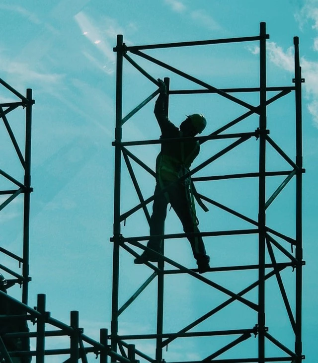 Construction worker on scafoling at Indco Building Solution